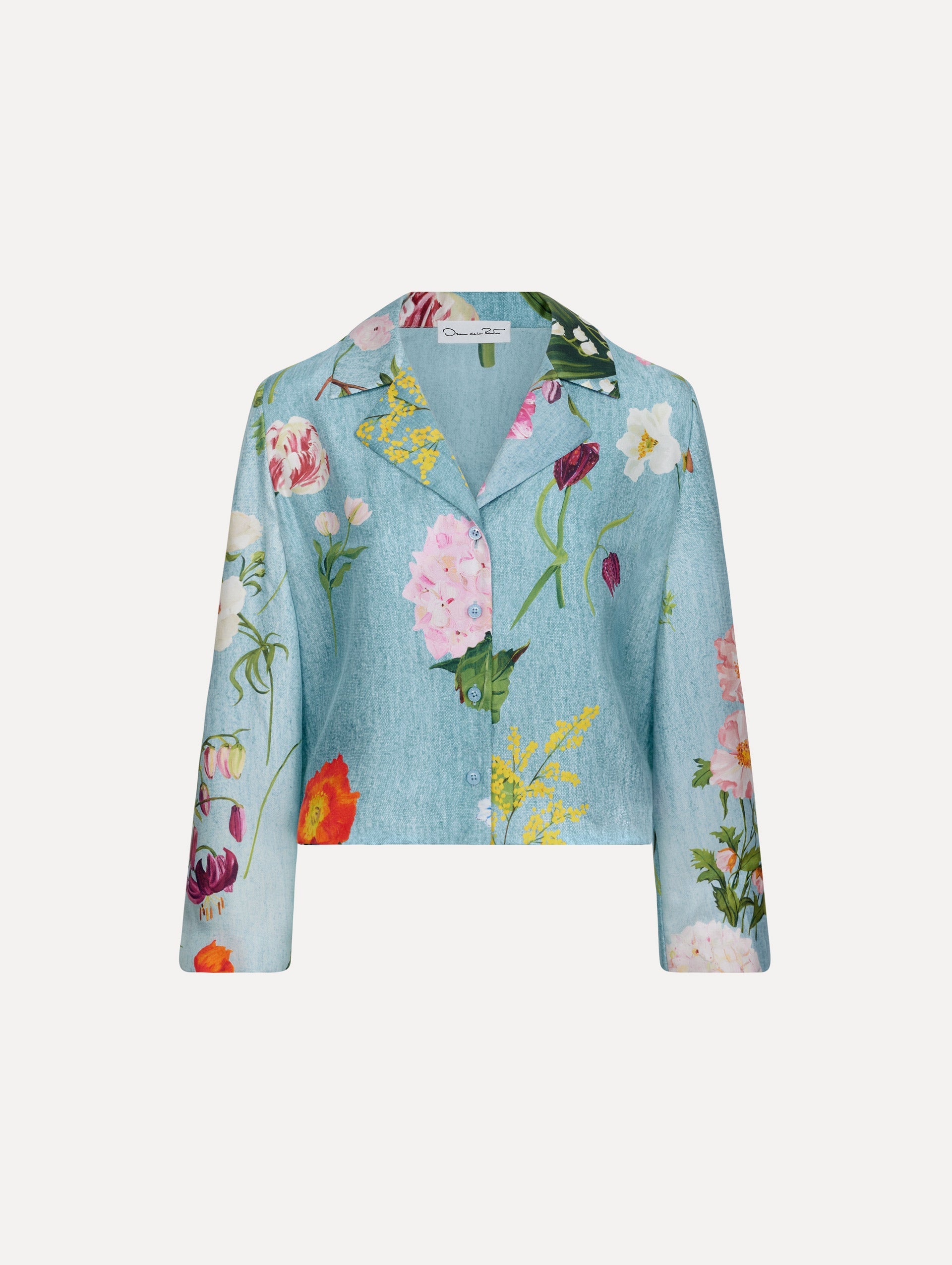 The model is wearing the mixed botanical silk twill blouse with long sleeves in the color blue multi.
