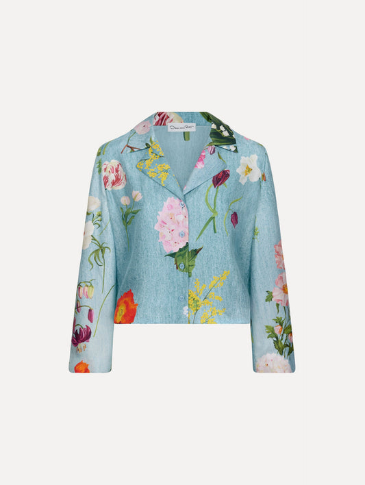 The model is wearing the mixed botanical silk twill blouse with long sleeves in the color blue multi.
