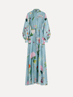 The model is wearing the mixed botanical silk twill caftan with long sleeves in blue multi.