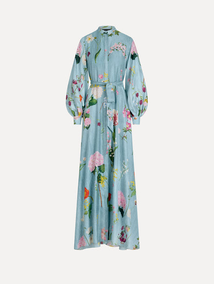 The model is wearing the mixed botanical silk twill caftan with long sleeves in blue multi.