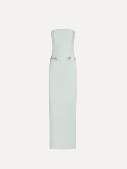 The Crystal Floral Embroidered Gown in Saltwater Blue. Featuring a strapless neckline, faux front flap pockets with crystal embroidery, and a long, column silhouette. Front View.