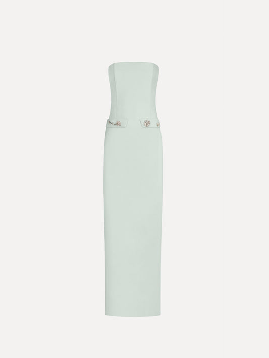 The Crystal Floral Embroidered Gown in Saltwater Blue. Featuring a strapless neckline, faux front flap pockets with crystal embroidery, and a long, column silhouette. Front View.