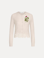 The Chiné Hibiscus Threadwork Cropped Cardigan in Ivory. Featuring a threaded Chiné hibiscus and intricate guipure lace trim. Front View.