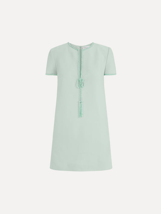 The Beaded Bow-Detail Shift Dress in Saltwater Blue. Featuring a beaded bow detail at the neckline with tassel ties and subtle trim along the edges. Front View.