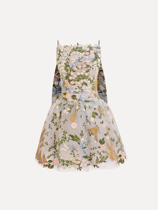 The Dominican Mixed-Floral Guipure Cape-Back Dress. Featuring a straight neckline, fitted bodice, flared mini skirt, and structural cape. Front View.