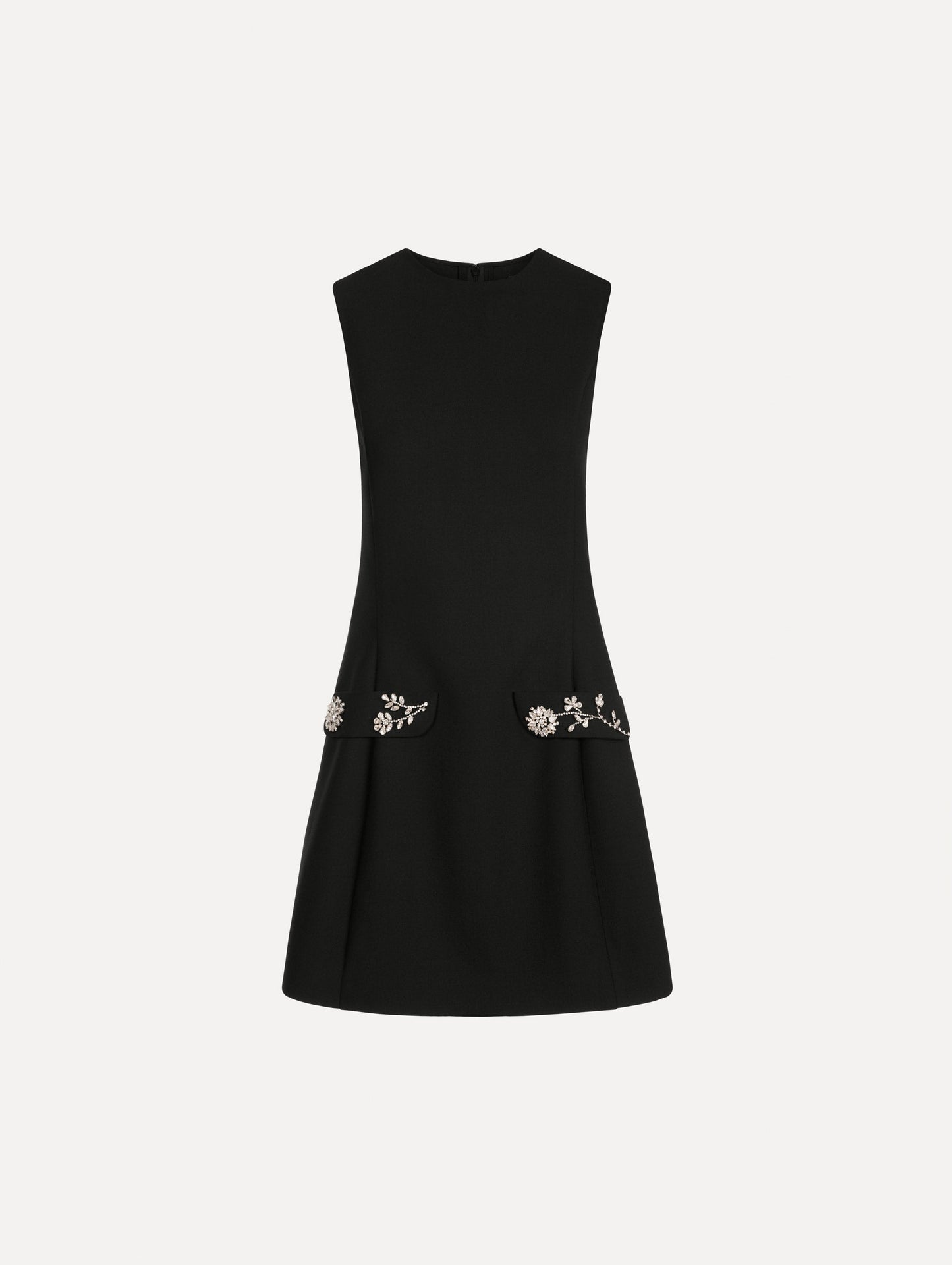 The Crystal Floral Embroidered Cocktail Dress in Black. Featuring faux front flap pockets with crystal embroidery and a structured mini skirt. Front View.
