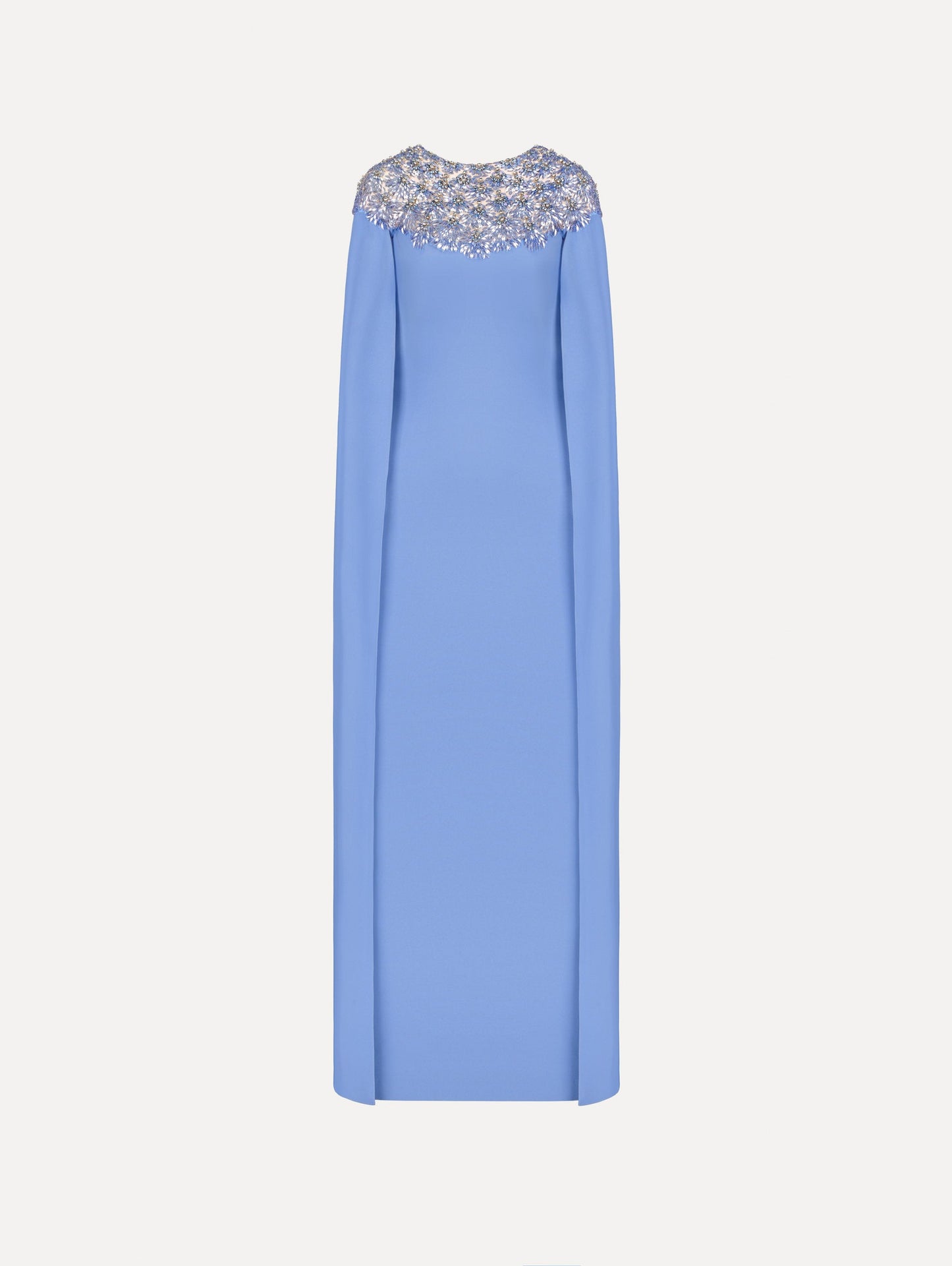 The Crystal & Glass Embroidered Caftan in a hydrangea blue color. Featuring crystal and glass bead embroidery at the collar, flowing cape-like sleeves, and a long skirt. Front View.