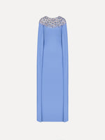 The Crystal & Glass Embroidered Caftan in a hydrangea blue color. Featuring crystal and glass bead embroidery at the collar, flowing cape-like sleeves, and a long skirt. Front View.
