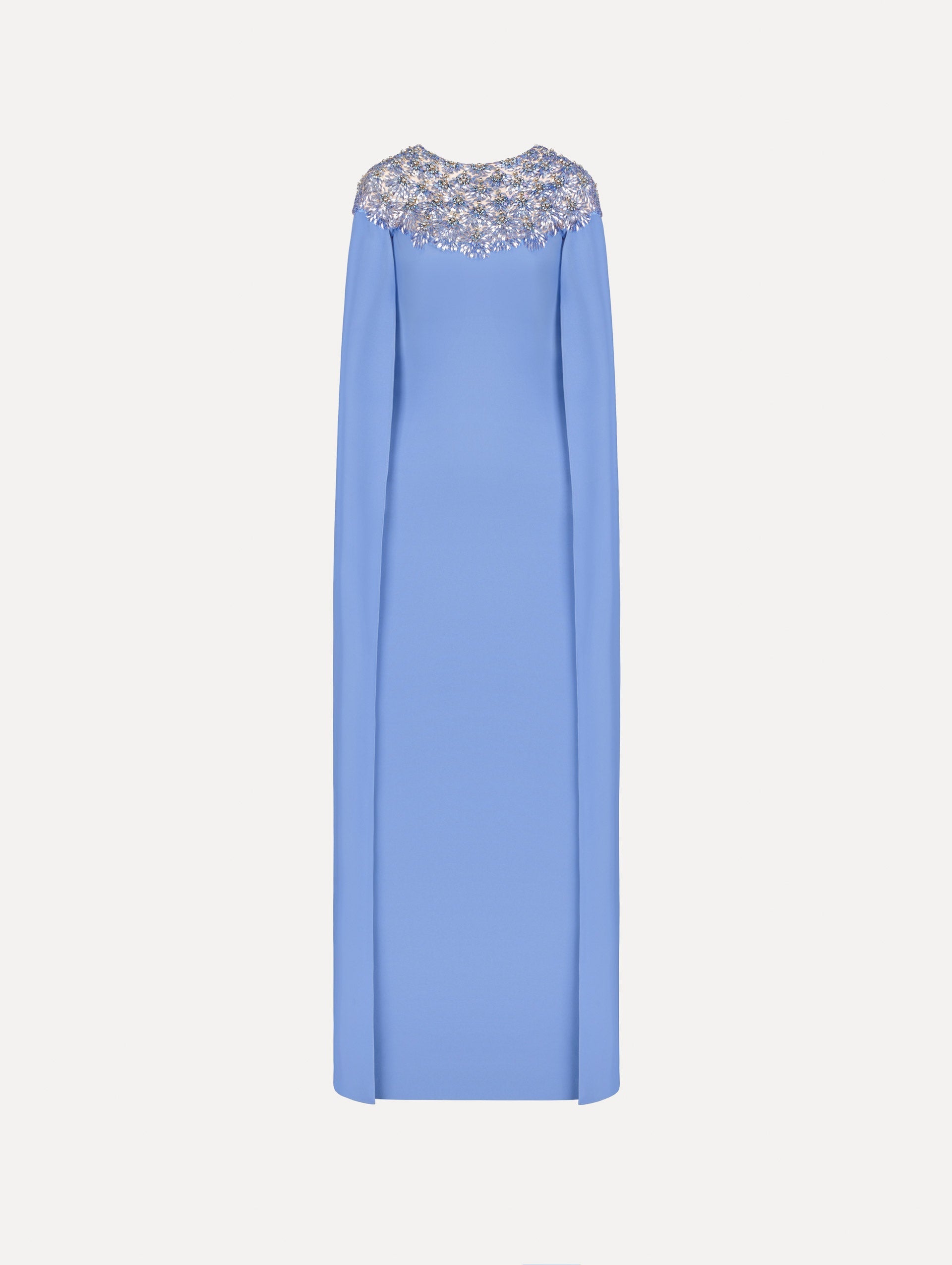 The Crystal & Glass Embroidered Caftan in a hydrangea blue color. Featuring crystal and glass bead embroidery at the collar, flowing cape-like sleeves, and a long skirt. Front View.