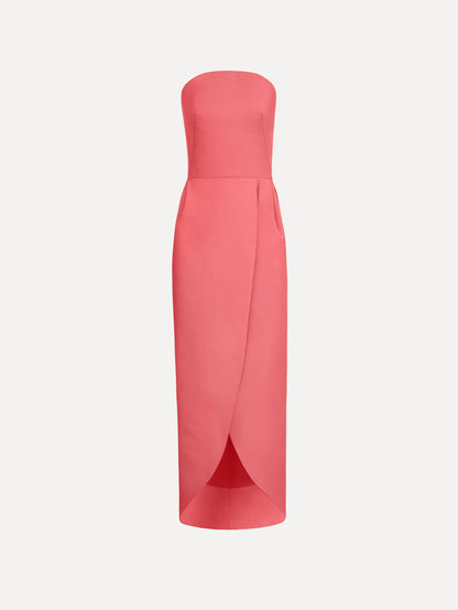 The Strapless Faille Gown in Guava Pink. Featuring a sculpted silhouette and wrap-style skirt with an asymmetrical hem. Front View.