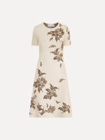 The Hibiscus Metallic Jacquard Dress in Ivory with Gold hibiscus motifs. Featuring short sleeves, a softly structured silhouette, and mini-length skirt. Front View.