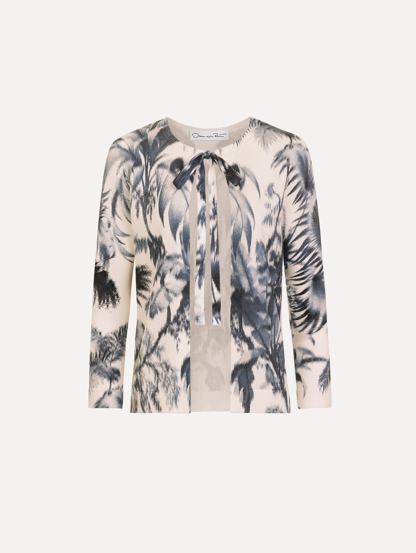 The Chiné Palm Leaves Cardigan in Navy and White. Featuring a crew neckline, quarter-length sleeves, banded trim, and tie front closure. Front View.