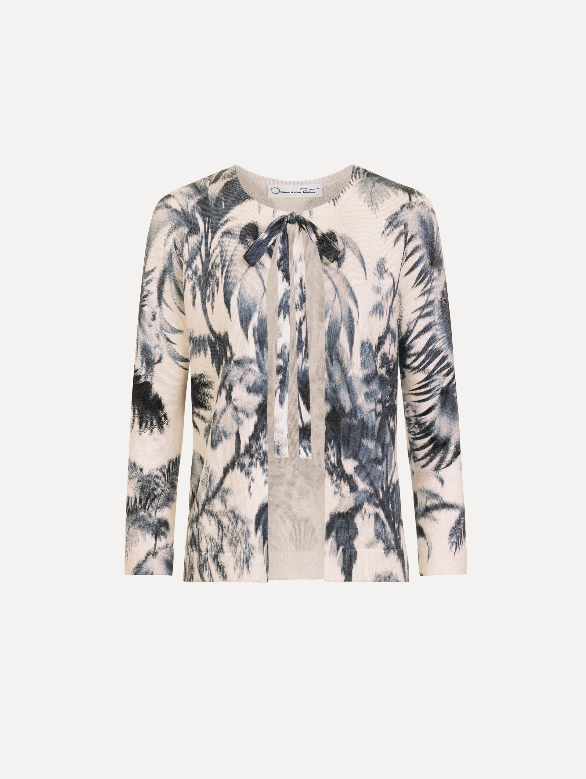 The Chiné Palm Leaves Cardigan in Navy and White. Featuring a crew neckline, quarter-length sleeves, banded trim, and tie front closure. Front View.
