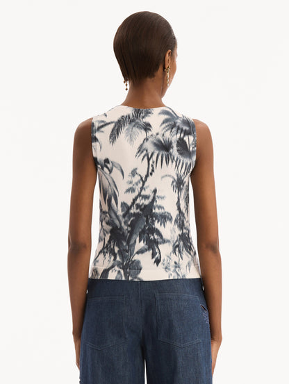 The model is wearing the Chiné Palm Leaves Tank in Navy and White. Featuring a crew neckline and banded trim. Back View.