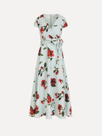 The Hibiscus Cotton Poplin Wrap Dress in light blue printed with red hibiscus blooms. Featuring a wrap construction bodice, cap sleeves, V-neckline, and full midi skirt. Front View.