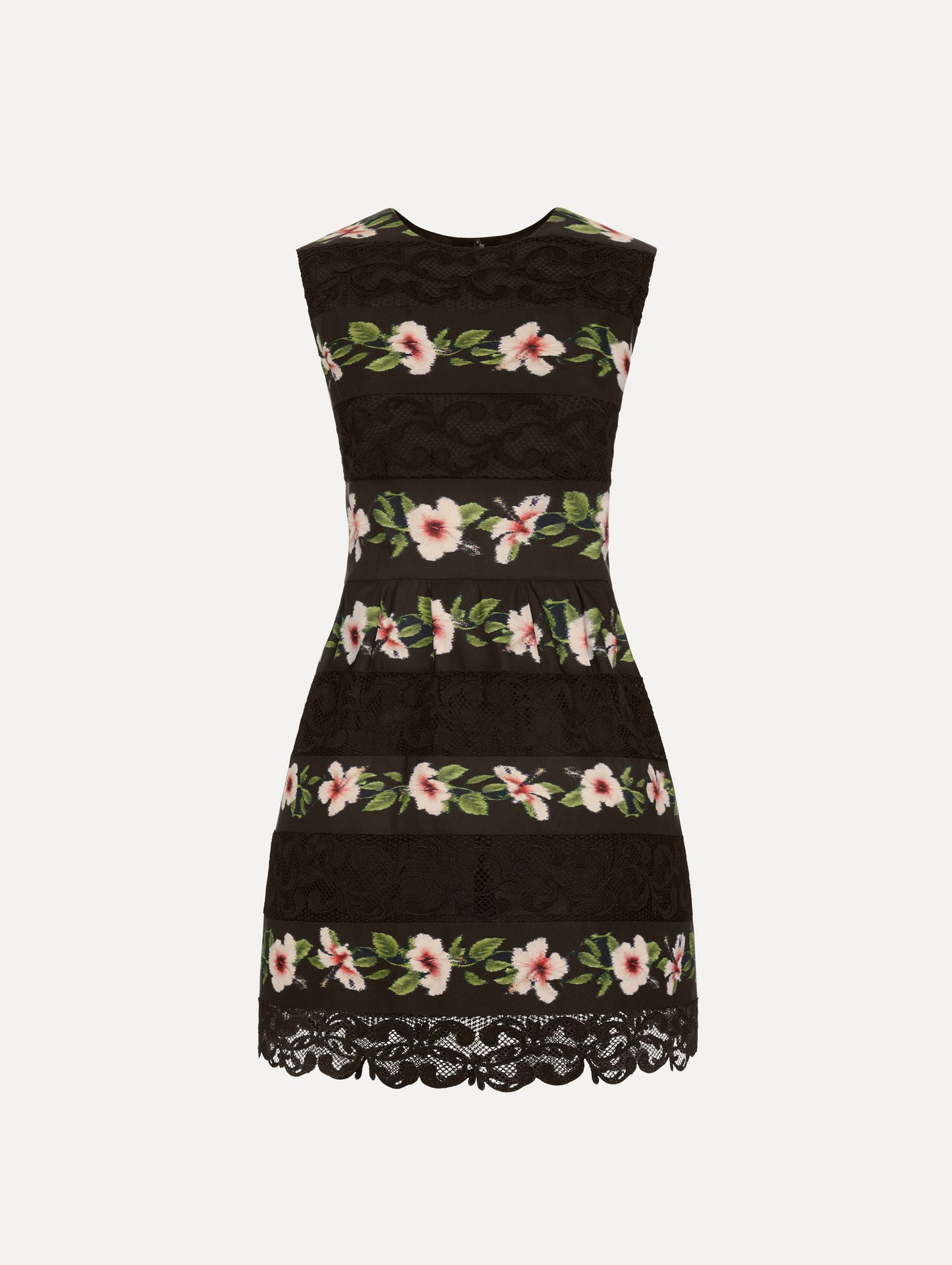 The Chiné Hibiscus Striped Faille Dress in Black. Featuring woven hibiscus motifs alternating with panels of faille and guipure lace, creating a striped pattern. Mini length. Front View.