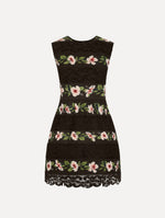 The Chiné Hibiscus Striped Faille Dress in Black. Featuring woven hibiscus motifs alternating with panels of faille and guipure lace, creating a striped pattern. Mini length. Front View.