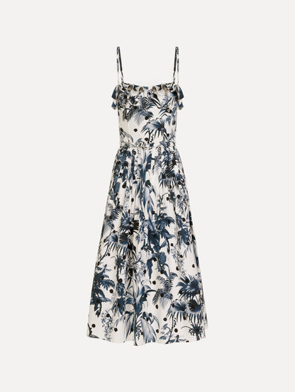 The Dotted Palm Leaves Cotton Poplin Sleeveless Dress in Navy Blue and White. Featuring a palm leaves print, ruffled top, delicate straps, belt at waist, softly structured bodice, and gathered skirt. Front View.