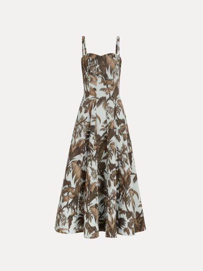 The Chiné Palm Leaves Cotton Poplin Dress in light blue printed with brown palm leaves. Featuring a subtle sweetheart neckline with tank straps, a softly structured bodice, and flowing midi skirt. Front View.