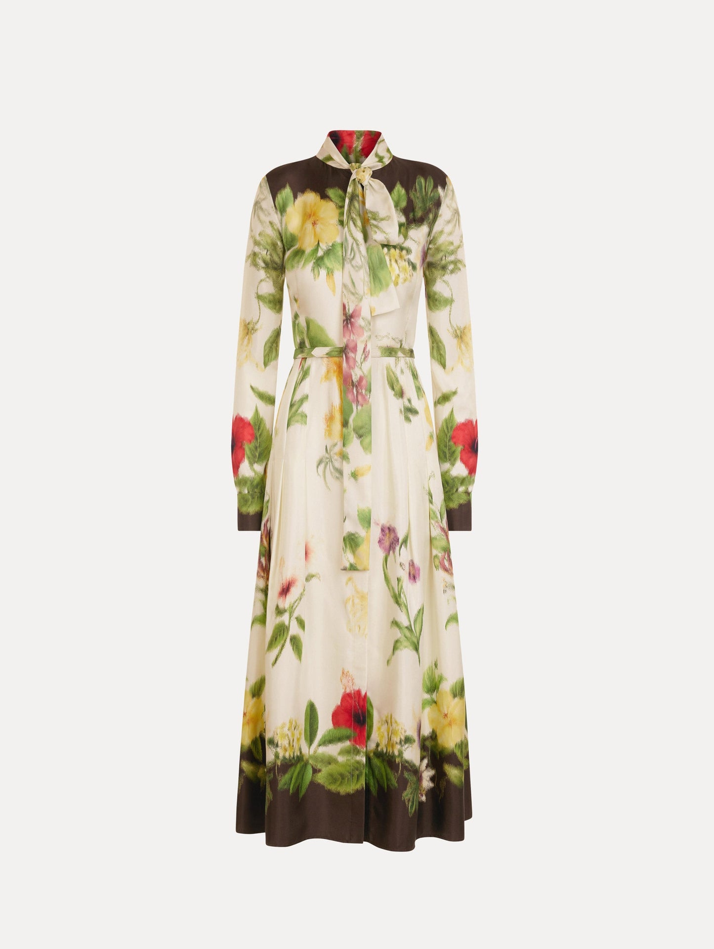 The Chiné Dominican Mixed-Floral Silk Twill Dress. Featuring a vibrant array of Dominican florals, tie neckline, belt at waist, long sleeves, and a midi length. Front View.