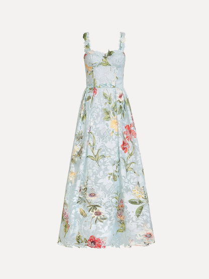 The Dominican Mixed-Floral Guipure Cocktail Dress in Saltwater Blue. Featuring floral detailing on straps, sweetheart neckline, structured bodice, and full skirt. Front View.
