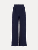 The model is wearing the slub wool tweed wide-leg pant in the color navy.
