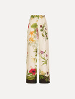 The Dominican Mixed-Floral Wide Leg Pant in ivory printed with an array of Dominican florals. Featuring wide legs and an elastic waistband. Front View.