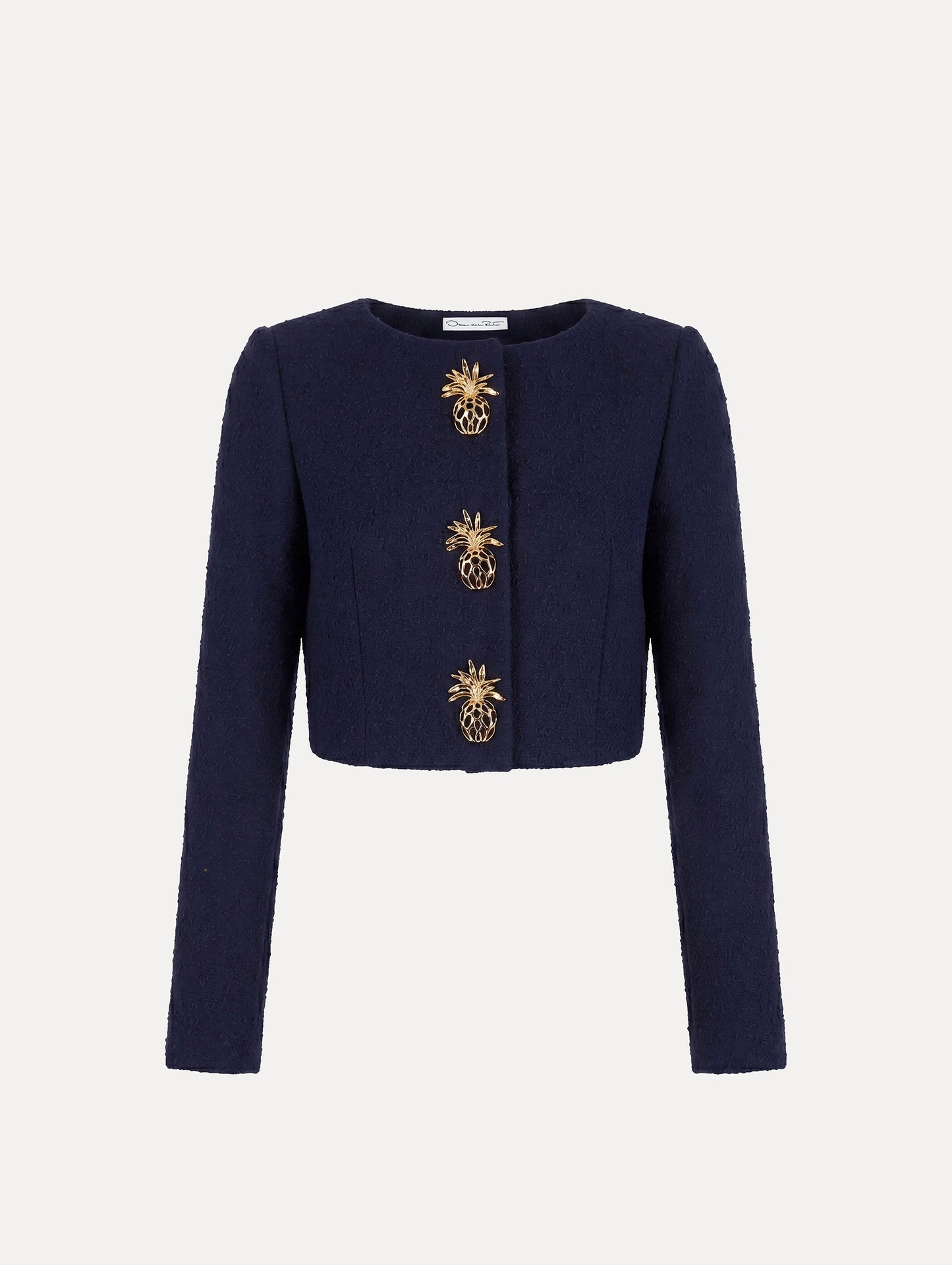 The model is wearing the slub wool tweed jacket with signature pineapple button detailing.