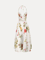 The Chiné Dominican Mixed-Floral Faille Cocktail Dress. Featuring a halter neckline, structured bodice, midi skirt, and belt at waist. Front View.