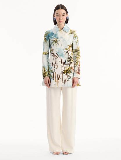 The model is wearing the Dominican Landscape Cotton Poplin Coat featuring an exaggerated collar, hidden buttons, front-flap pockets, and long sleeves. Front View.