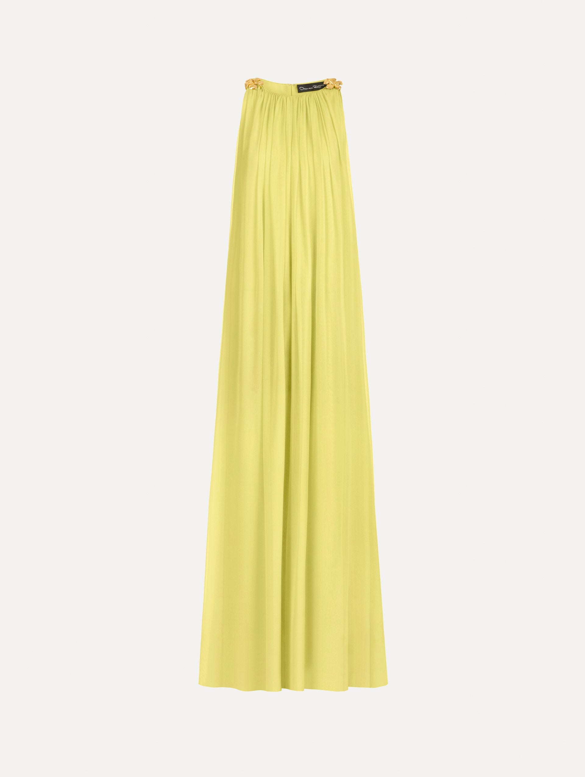 The Hibiscus-Detail Silk Chiffon Caftan in a light yellow-green color. Featuring a draping, gathered silhouette, long skirt, and sculptural hibiscus details at the shoulders. Front View.