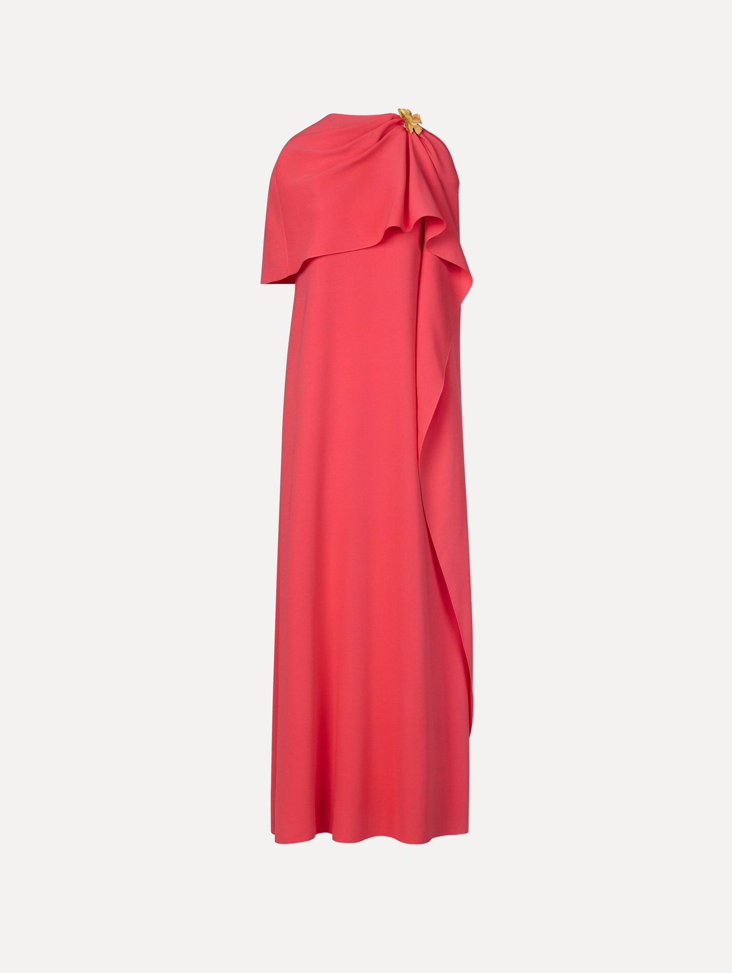 The Hibiscus Brooch Georgette Caftan in Hot Pink. Featuring a softly structured cape silhouette and a sculptural hibiscus brooch accent at the shoulder. Front View.