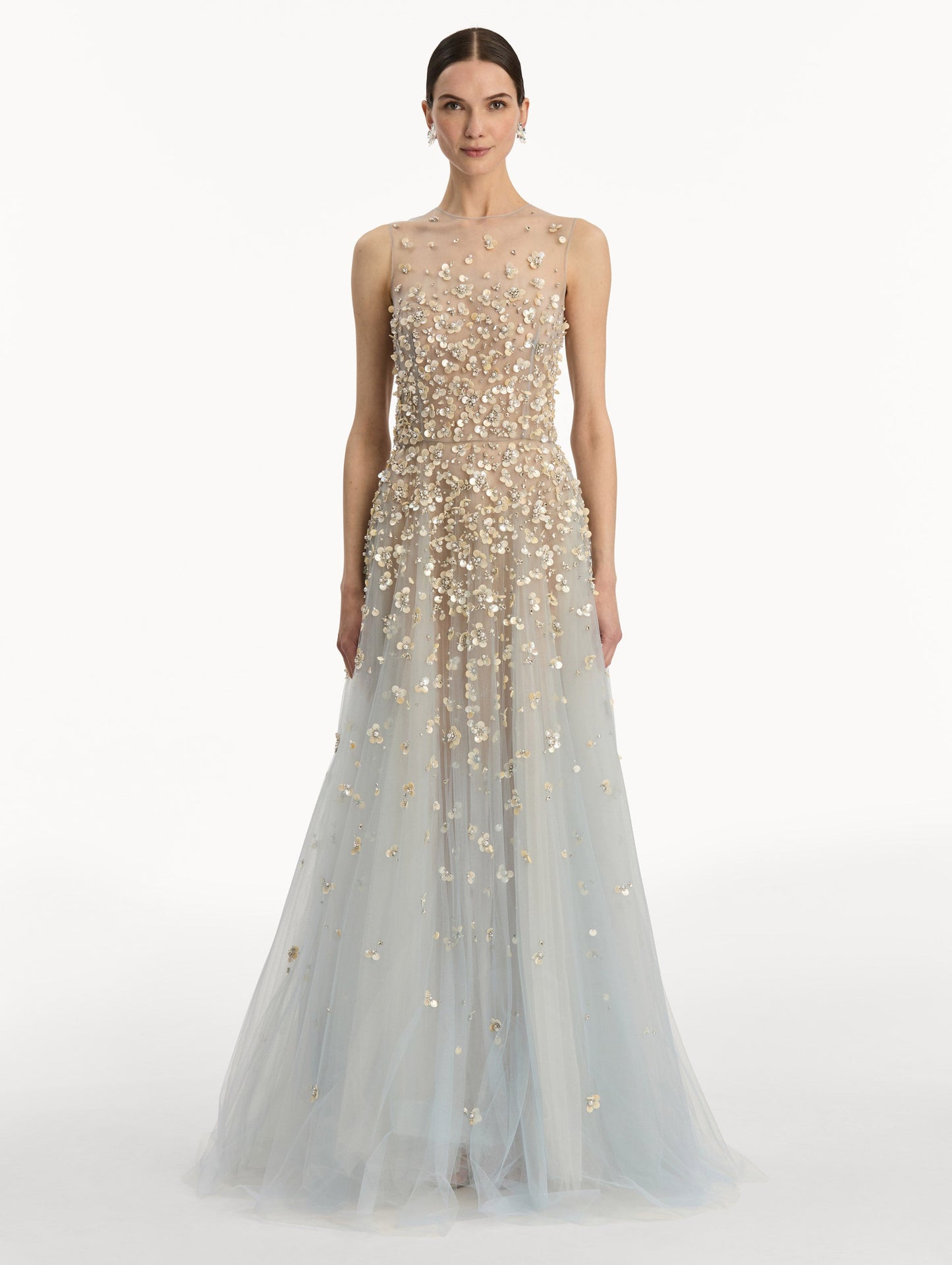Tan and pale blue Embroidered Illusion Gown with flowing embellished skirt and scattered floral appliques. Front View.