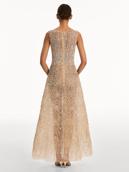 Beige Crystal Wave Embroidered Dress with strapless wave neckline and sheer metallic finish. Back View.