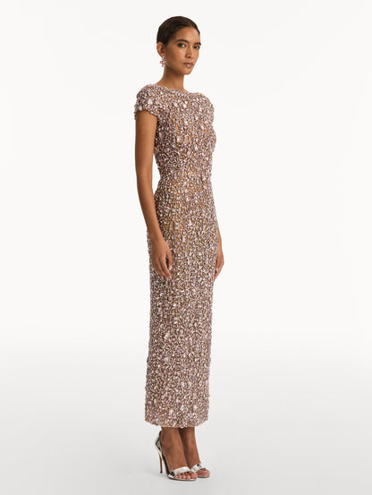 Beige Mosaic Crystal Embroidered Gown with a fitted silhouette and cap sleeves. Side View.