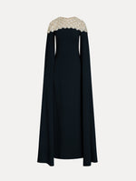 Navy Embroidered Caftan with ivory embroidered neckline and floor-length draped silhouette. Front View.