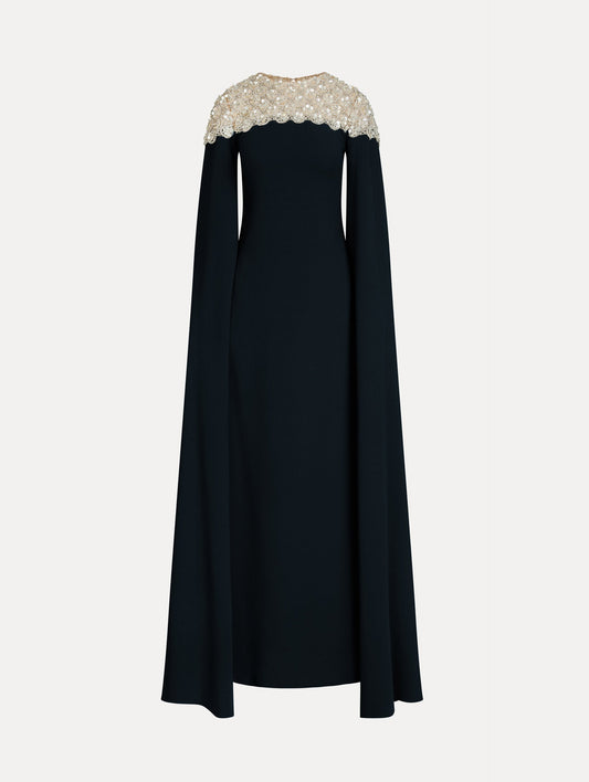 Navy Embroidered Caftan with ivory embroidered neckline and floor-length draped silhouette. Front View.