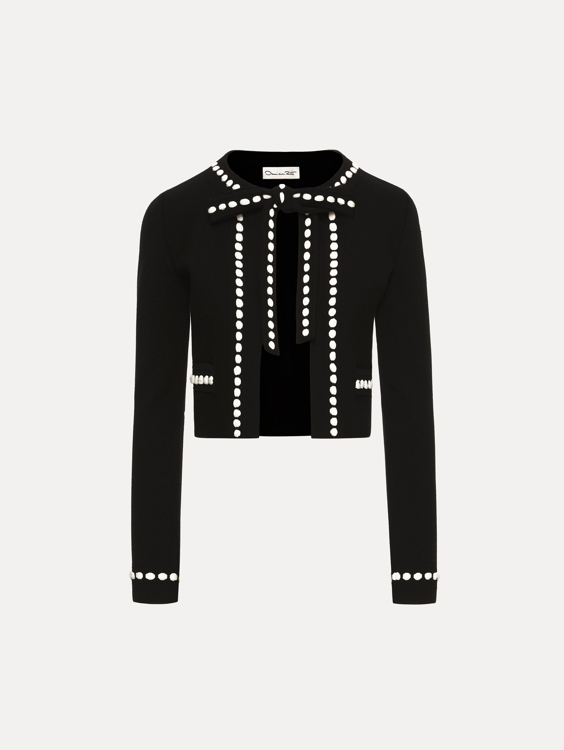 Black and White Bubble Trim Cardigan featuring white beaded trim, long sleeves, and a tie-neck collar.