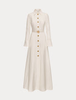 Ivory Oscar Chain-Link Cotton Poplin Caftan featuring a collared neckline, flared sleeves, gold button front, and belted waist with floral buckle.