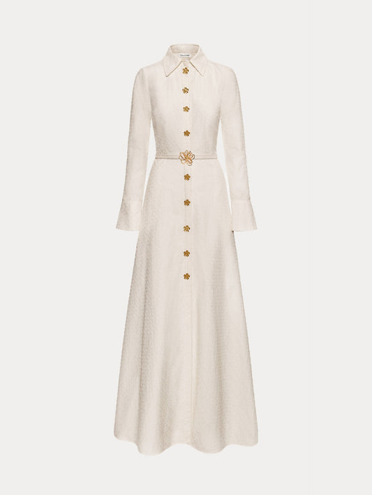 Ivory Oscar Chain-Link Cotton Poplin Caftan featuring a collared neckline, flared sleeves, gold button front, and belted waist with floral buckle.