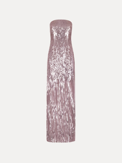 The Sequin Fringe Strapless Gown in the color tulip pink featuring a strapless silhouette, all-over sequins, and fringe skirt.