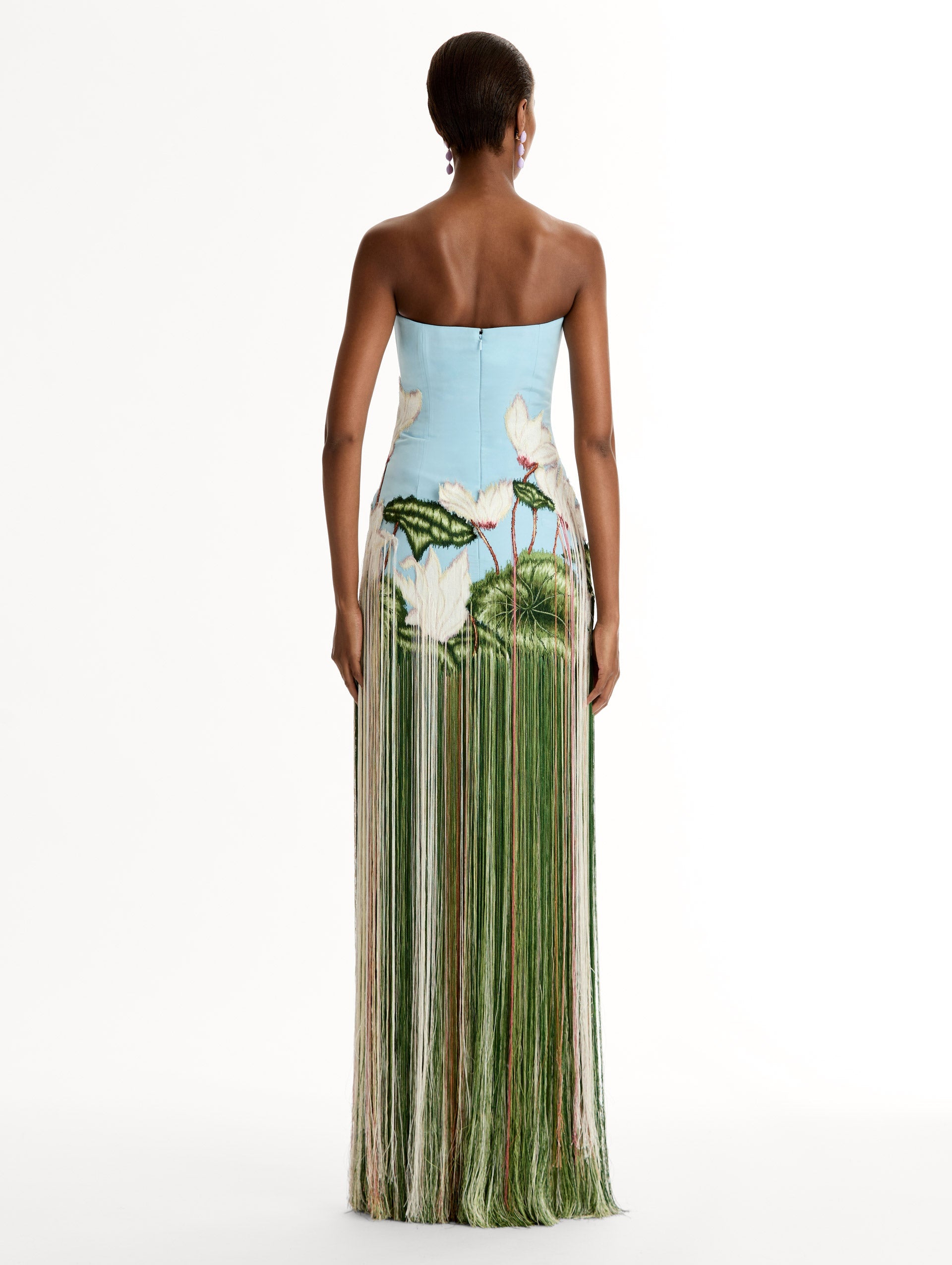 Strapless, Floor length silk faille gown with Chiné Cyclamen motif on threadwork fringe. Clean lines and a fitted bodice frame the embroidery. Back View.