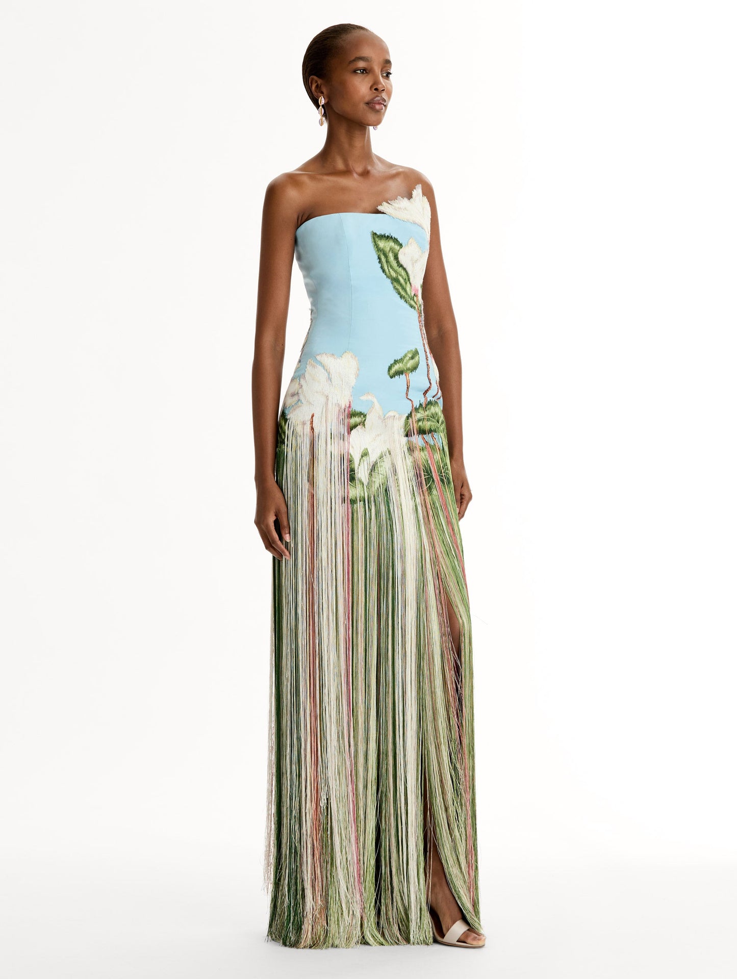 Strapless, Floor length silk faille gown with Chiné Cyclamen motif on threadwork fringe. Clean lines and a fitted bodice frame the embroidery. Side View.