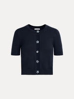Cropped navy crew neck cardigan, short sleeves, floral buttons. Front View.