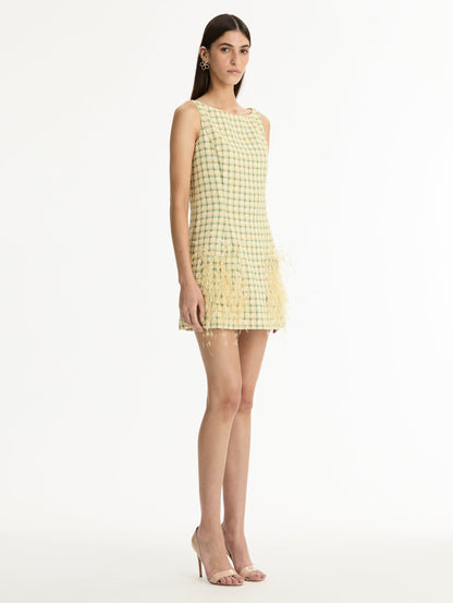 Green and Yellow Checked Tweed Dress with Point D'Esprit Feather Embroidery featuring a bateau neckline with 3D yellow feather applique at the hemline. Side View.