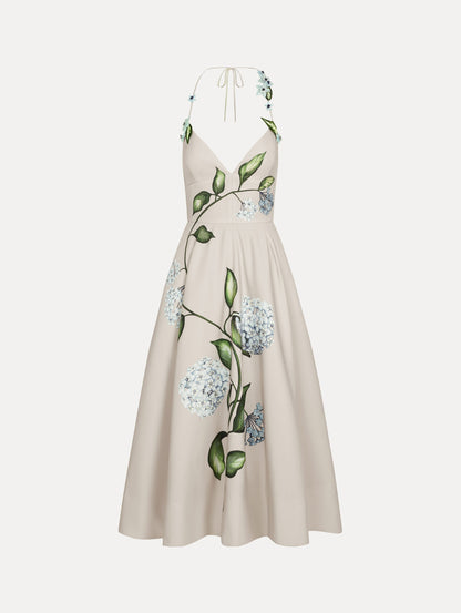 Dress in the colors White and Denim Blue with delicate halter V-neck, flowy skirt, and flower motif.