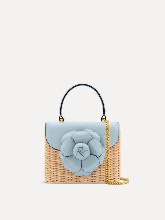Blue Wicker Mini TRO Bag with a flower clasp and blue leather flap. Front View.
