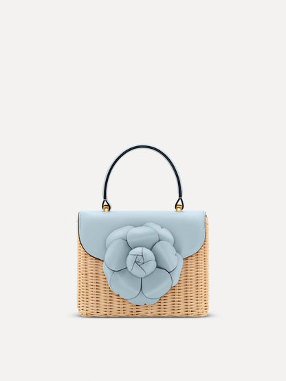Blue Wicker Mini TRO Bag with a flower clasp and blue leather flap. Front View.
