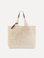 White Topaz in Crochet Raffia with white leather handle and crochet embroidered flower motifs. Front View.
