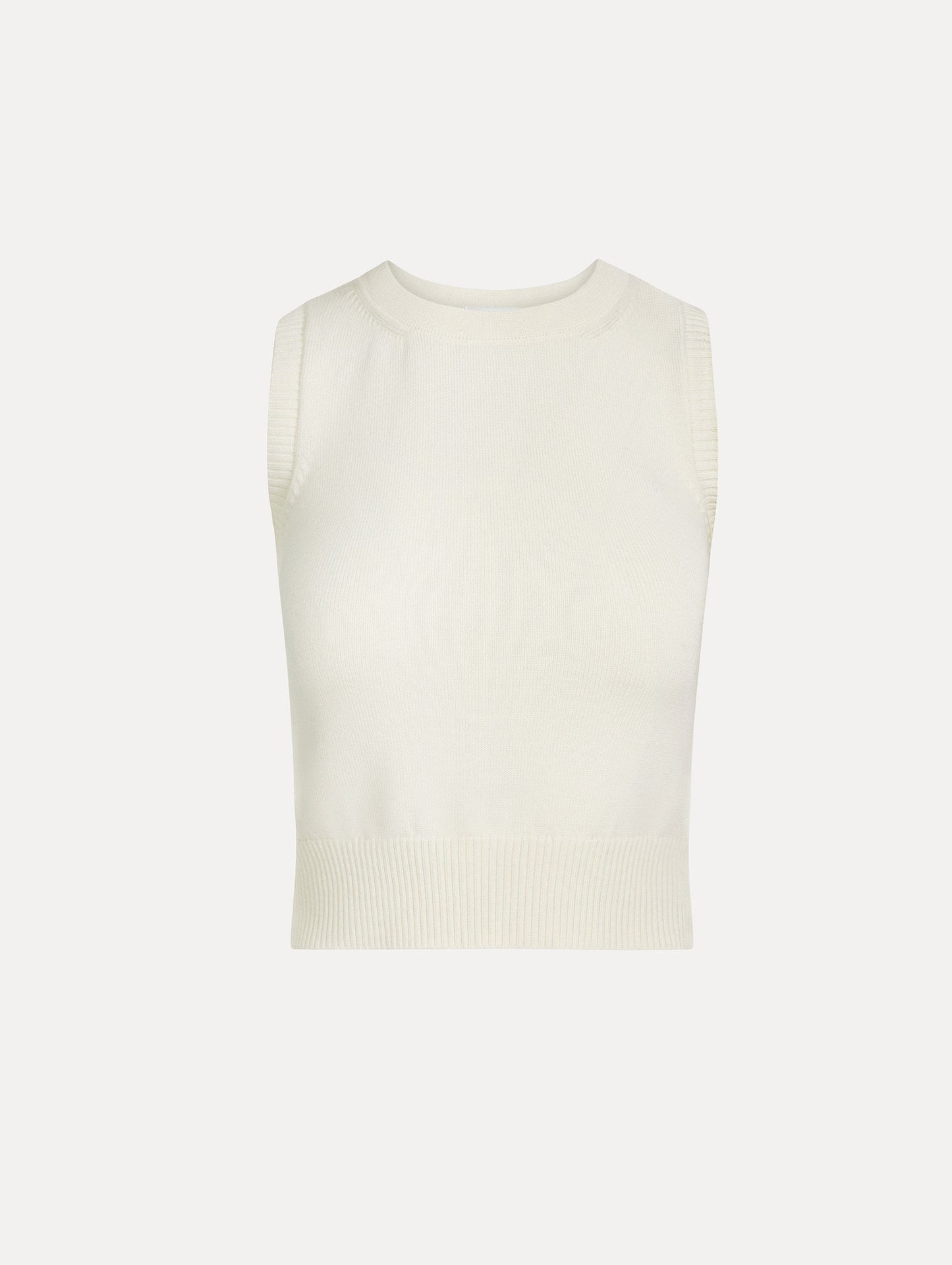 Sleeveless, halter neck, classic knit tank in soft ivory. Front View.